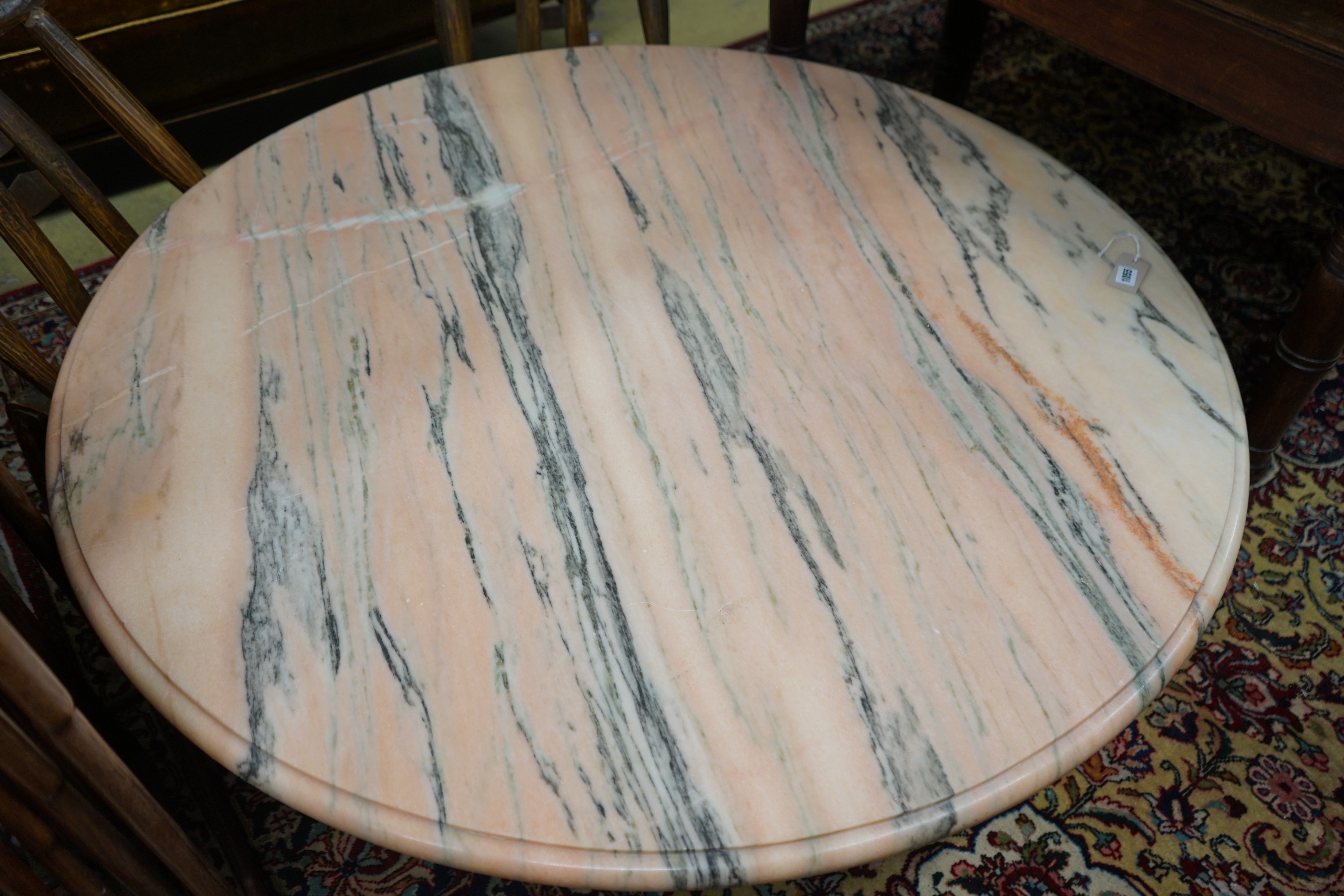 A circular marble top coffee table, diameter 130cm, height 40cm